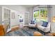 Cozy living area features a window with bright natural light and comfortable seating perfect for relaxation at 138 Meadow View Dr, Statesville, NC 28677