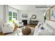 Bright living room featuring a fireplace, hardwood floors, and comfortable seating area at 138 Meadow View Dr, Statesville, NC 28677
