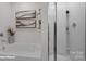 This bathroom features a separate tub and shower, as well as modern decor at 140 Meadow View Dr, Statesville, NC 28677