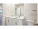 Well-lit bathroom featuring double sinks with white vanities at 140 Meadow View Dr, Statesville, NC 28677