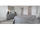 This bedroom features a gray dresser, and leads into the walk-in closet and Primary bathroom at 140 Meadow View Dr, Statesville, NC 28677