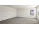 Bright, carpeted bedroom with ample natural light from the window at 140 Meadow View Dr, Statesville, NC 28677
