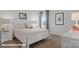 This well-lit bedroom has a comfy bed, and a matching white night stand and dresser at 140 Meadow View Dr, Statesville, NC 28677