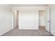 Neutral carpeted bedroom with two entry doors at 140 Meadow View Dr, Statesville, NC 28677