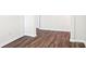 A neutral hallway with wood floors provides seamless transition between spaces, enhancing flow throughout the home at 140 Meadow View Dr, Statesville, NC 28677