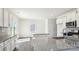 A bright kitchen featuring granite countertops, stainless appliances, and wood floors offers generous counter space at 140 Meadow View Dr, Statesville, NC 28677