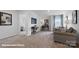 Spacious living area offers multiple seating areas, plush carpeting, and abundant natural light at 140 Meadow View Dr, Statesville, NC 28677