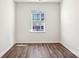 A minimalist room with wood floors, abundant natural light, and clean design creating a serene ambiance at 140 Meadow View Dr, Statesville, NC 28677