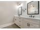 Elegant bathroom with dual sinks, quartz countertops, and modern fixtures at 14119 Shelburne Village Dr, Charlotte, NC 28278