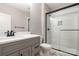 Bathroom featuring a tile surround shower and a gray vanity at 14119 Shelburne Village Dr, Charlotte, NC 28278