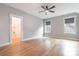 Sunlit bedroom featuring hardwood flooring and modern gray wall color at 14119 Shelburne Village Dr, Charlotte, NC 28278