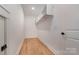 Walk-in closet with hardwood floors and shelving at 14119 Shelburne Village Dr, Charlotte, NC 28278