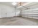 Spacious two car garage featuring white walls and concrete flooring at 14119 Shelburne Village Dr, Charlotte, NC 28278