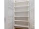 Walk-in pantry features ample shelving and wire baskets for organized storage at 14119 Shelburne Village Dr, Charlotte, NC 28278