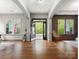 Spacious foyer with hardwood floors, an open front door and an abundance of natural light at 1515 Millbridge Pkwy, Waxhaw, NC 28173