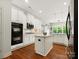 Bright kitchen featuring white cabinetry, stainless steel appliances, and a center island at 1515 Millbridge Pkwy, Waxhaw, NC 28173
