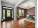 Inviting living room showcasing hardwood floors and a comfortable seating area bathed in natural light at 1515 Millbridge Pkwy, Waxhaw, NC 28173