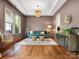 Warm living room with hardwood floors, a coffered ceiling, and comfortable seating at 1515 Millbridge Pkwy, Waxhaw, NC 28173