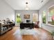 Cozy office space with hardwood floors and a comfortable chair and large desk at 1515 Millbridge Pkwy, Waxhaw, NC 28173