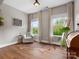 Bright sitting room with hardwood floors, large windows, and comfortable seating at 1515 Millbridge Pkwy, Waxhaw, NC 28173