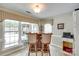 Cozy bar area with natural light streaming through large windows at 15306 Gower Ct, Charlotte, NC 28278