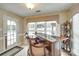 Inviting bar area featuring barstool seating and natural light at 15306 Gower Ct, Charlotte, NC 28278
