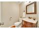 Charming powder room with a decorative mirror and classic fixtures at 15306 Gower Ct, Charlotte, NC 28278