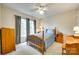 Comfortable bedroom with natural light, neutral walls, curtains, and traditional furnishings at 15306 Gower Ct, Charlotte, NC 28278