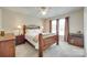 Bedroom featuring ceiling fan, natural light from windows, bedside lamps and furniture at 15306 Gower Ct, Charlotte, NC 28278