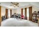 Bedroom or office space featuring carpet, ceiling fan and natural light from two windows at 15306 Gower Ct, Charlotte, NC 28278