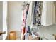 Walk-in closet with rods full of organized clothing and other personal items at 15306 Gower Ct, Charlotte, NC 28278
