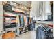 Organized walk-in closet with shelving and hanging space for optimal storage at 15306 Gower Ct, Charlotte, NC 28278