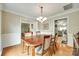 Spacious dining room with hardwood floors and doorway to living room and kitchen at 15306 Gower Ct, Charlotte, NC 28278