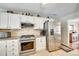 Bright kitchen featuring stainless steel appliances, granite counters, and ample storage space at 15306 Gower Ct, Charlotte, NC 28278