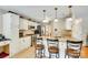 Bright kitchen with white cabinets, granite countertops, and stainless steel appliances at 15306 Gower Ct, Charlotte, NC 28278