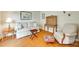 Comfortable living room with hardwood floors, sofa, desk, and chair at 15306 Gower Ct, Charlotte, NC 28278