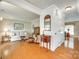 Inviting living room featuring hardwood floors, neutral paint, and natural lighting at 15306 Gower Ct, Charlotte, NC 28278