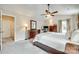 Bright main bedroom with a vaulted ceiling, ceiling fan, and large windows at 15306 Gower Ct, Charlotte, NC 28278