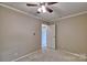 A bedroom with neutral walls, base trim and a closet at 1774 Wintertide Rd, Jefferson, SC 29718