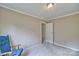 A cozy bedroom featuring neutral paint and a vintage chair at 1774 Wintertide Rd, Jefferson, SC 29718
