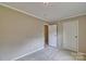 Neutral bedroom with a window offering natural light and an access door at 1774 Wintertide Rd, Jefferson, SC 29718