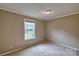 A bedroom with neutral walls, base trim and a window at 1774 Wintertide Rd, Jefferson, SC 29718