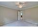 Neutral bedroom with a window offering natural light and an access door at 1774 Wintertide Rd, Jefferson, SC 29718