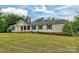 Charming single-story home featuring a covered front porch and well-maintained landscaping at 1774 Wintertide Rd, Jefferson, SC 29718