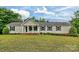 Charming one-story home with well-manicured lawn, complemented by mature landscaping at 1774 Wintertide Rd, Jefferson, SC 29718
