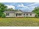 Charming ranch-style home with a welcoming porch, beautiful lawn, and lovely landscaping at 1774 Wintertide Rd, Jefferson, SC 29718