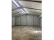 Spacious metal garage featuring concrete flooring, overhead lighting, and ample room for parking and storage at 1774 Wintertide Rd, Jefferson, SC 29718
