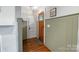 Inviting entryway features wood door, and elegant wall paneling at 1933 Thurmond Pl, Charlotte, NC 28205