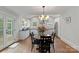 Eat-in kitchen features stainless appliances, white cabinets, and subway tile backsplash at 1933 Thurmond Pl, Charlotte, NC 28205