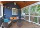 Relaxing porch with wicker furniture, string lights, and a view of the surrounding yard at 1933 Thurmond Pl, Charlotte, NC 28205
